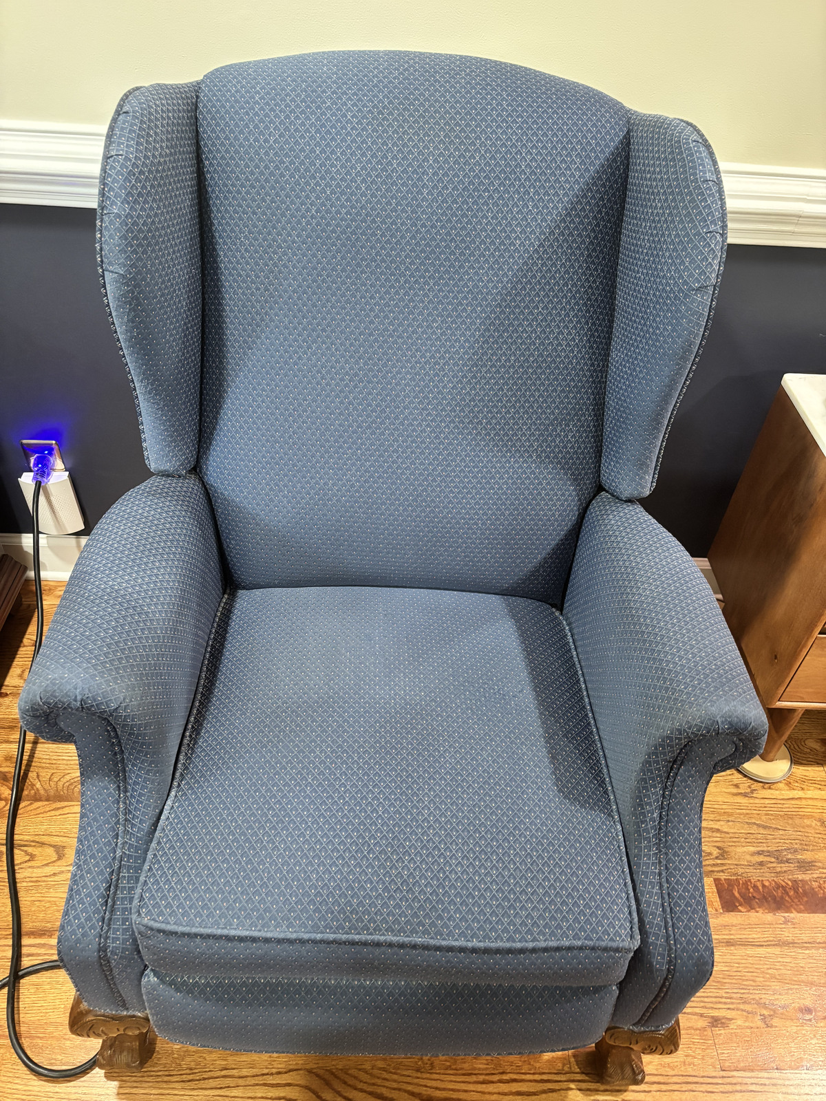 Freshly cleaned blue wingback armchair