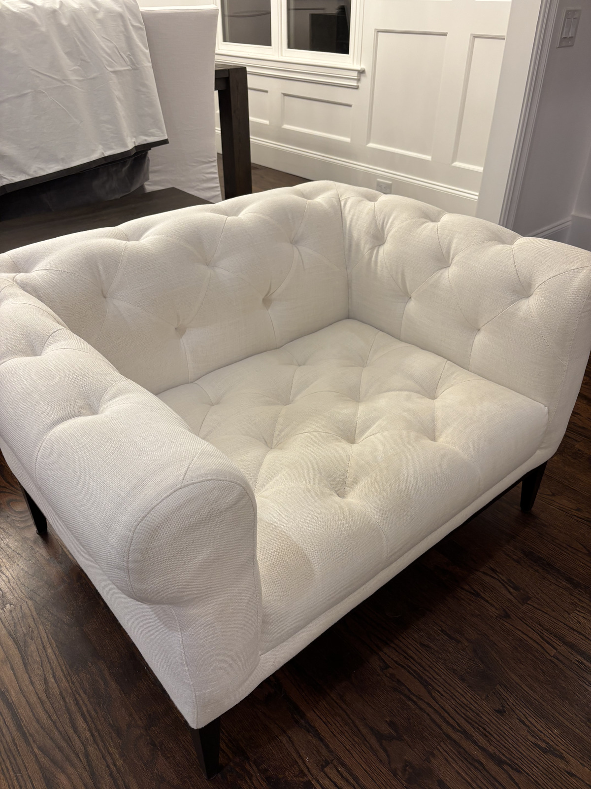 Cream tufted loveseat after professional fabric cleaning